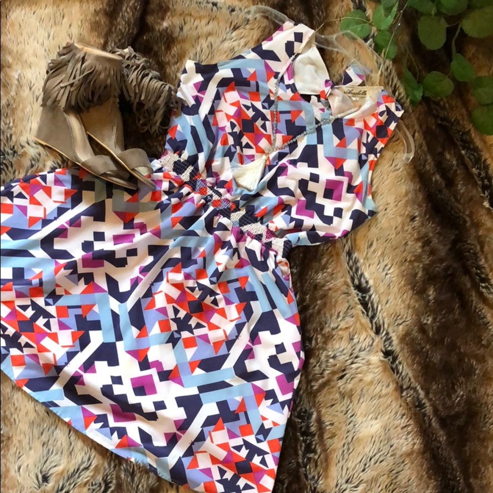 Geometric pattern dress with cutout back. Medium